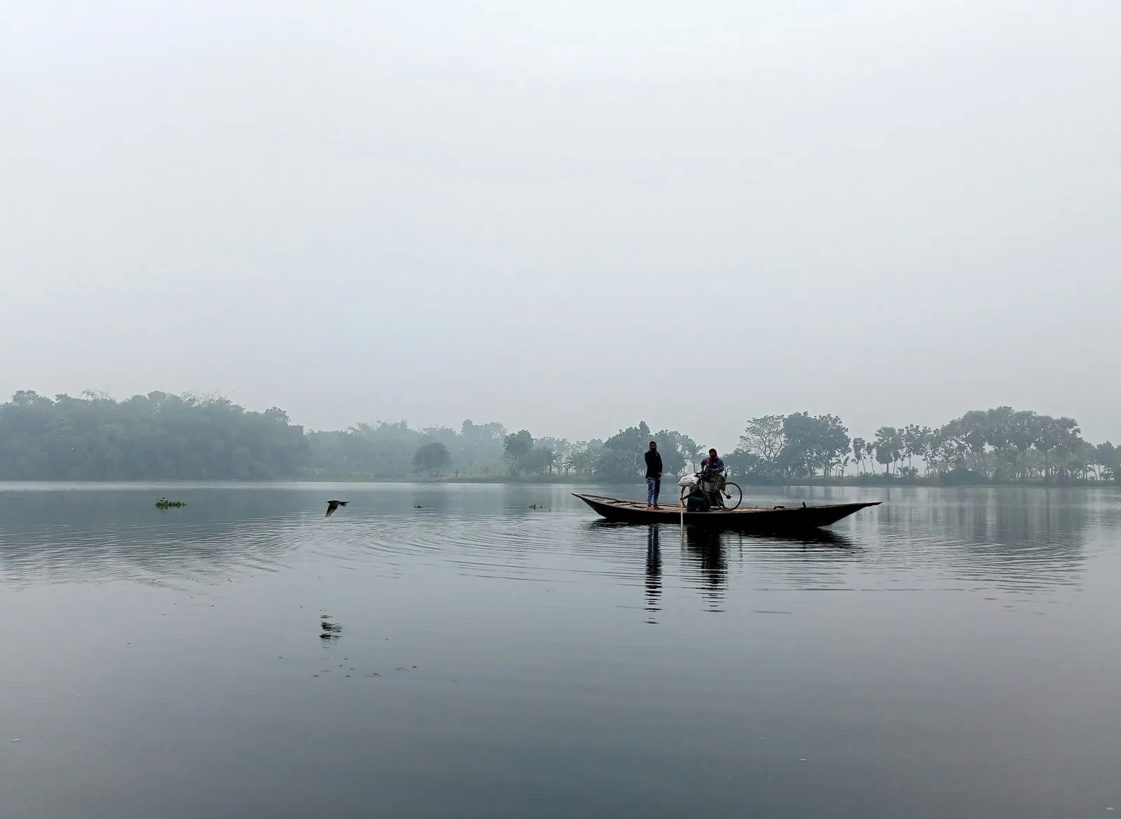 A boat on a misty lake